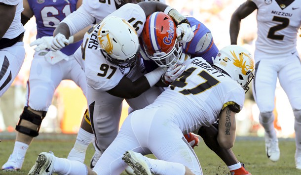 Nov 3, 2018; Gainesville, FL, USA; Missouri Tigers linebacker Cale Garrett (47) and Missouri Tigers defensive lineman Akial Byers (97) tackle Florida Gators running back Lamical Perine (22) during the first quarter at Ben Hill Griffin Stadium. Photo Credit: Kim Klement-USA TODAY Sports