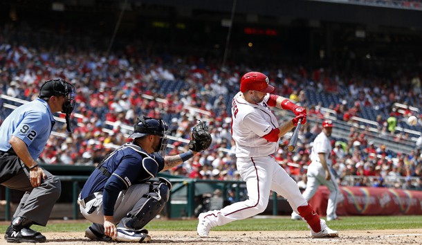 Aug 18, 2019; Washington, DC, USA; Washington Nationals second baseman Brian Dozier (9) hits a three run home run against the Milwaukee Brewers in the third inning at Nationals Park. Photo Credit: Geoff Burke-USA TODAY Sports