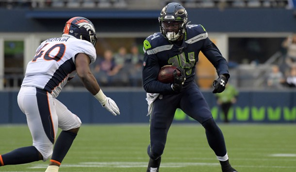 Aug 8, 2019; Seattle, WA, USA; Seattle Seahawks wide receiver D.K. Metcalf (14) runs the ball against Denver Broncos linebacker Keishawn Bierria (40) in the first half at CenturyLink Field.   Photo Credit: Kirby Lee-USA TODAY Sports