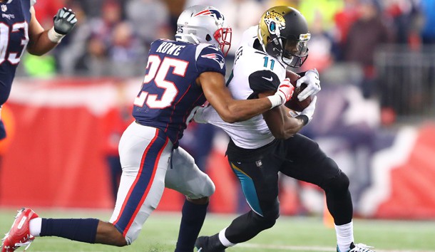 Jan 21, 2018; Foxborough, MA, USA; Jacksonville Jaguars wide receiver Marqise Lee (11) is tackled by New England Patriots cornerback Eric Rowe (25) in the AFC Championship Game at Gillette Stadium. Photo Credit: Mark J. Rebilas-USA TODAY Sports