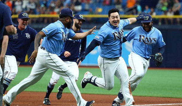 Aug 18, 2019; St. Petersburg, FL, USA;Tampa Bay Rays first baseman Ji-Man Choi (26) celebrates with relief pitcher Jose Alvarado (46), relief pitcher Diego Castillo (63) and teammates as he hit the game winning walk off two-RBI single during the ninth inning to beat the Detroit Tigers at Tropicana Field. Photo Credit: Kim Klement-USA TODAY Sports