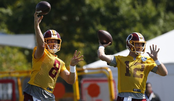 Jul 25, 2019; Richmond, VA, USA; Washington Redskins quarterback Case Keenum (8) and Redskins quarterback Colt McCoy (12) pass the ball during drills as part of day one of Redskins training camp at Bon Secours Washington Redskins Training Center. Photo Credit: Geoff Burke-USA TODAY Sports